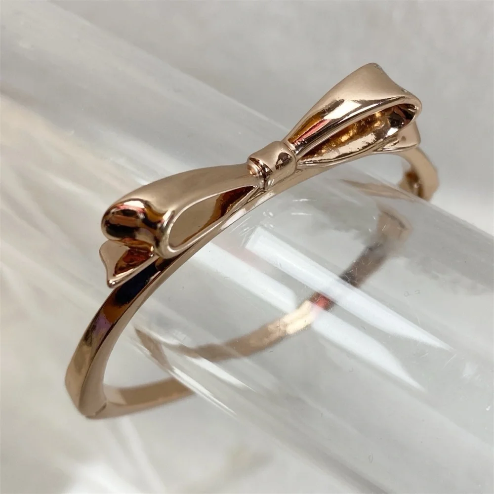 KATE SPADE • Rose Gold Bow Love Notes Bangle Bracelet - Picture 2 of 9